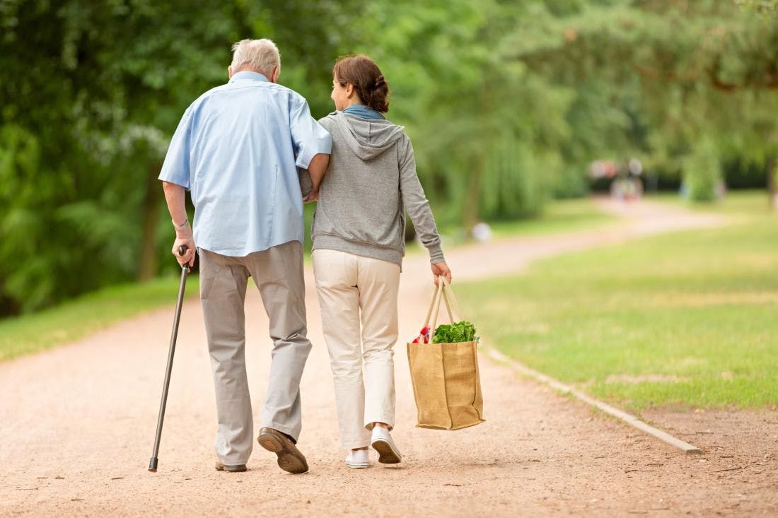 Older man walking with companion