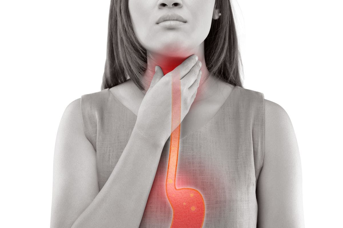 esophagus highlighted through woman touching her throat