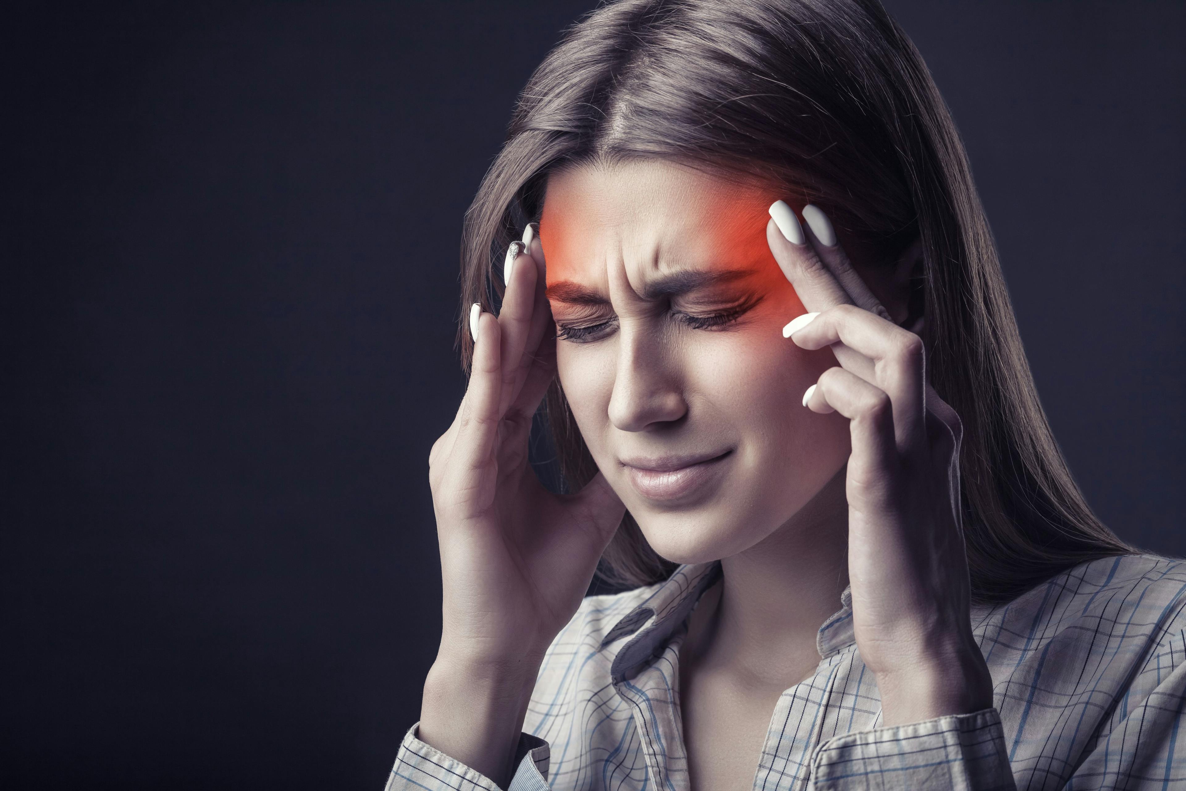 Female patient with headache pain | Image Credit: Artem Furman - stock.adobe.com