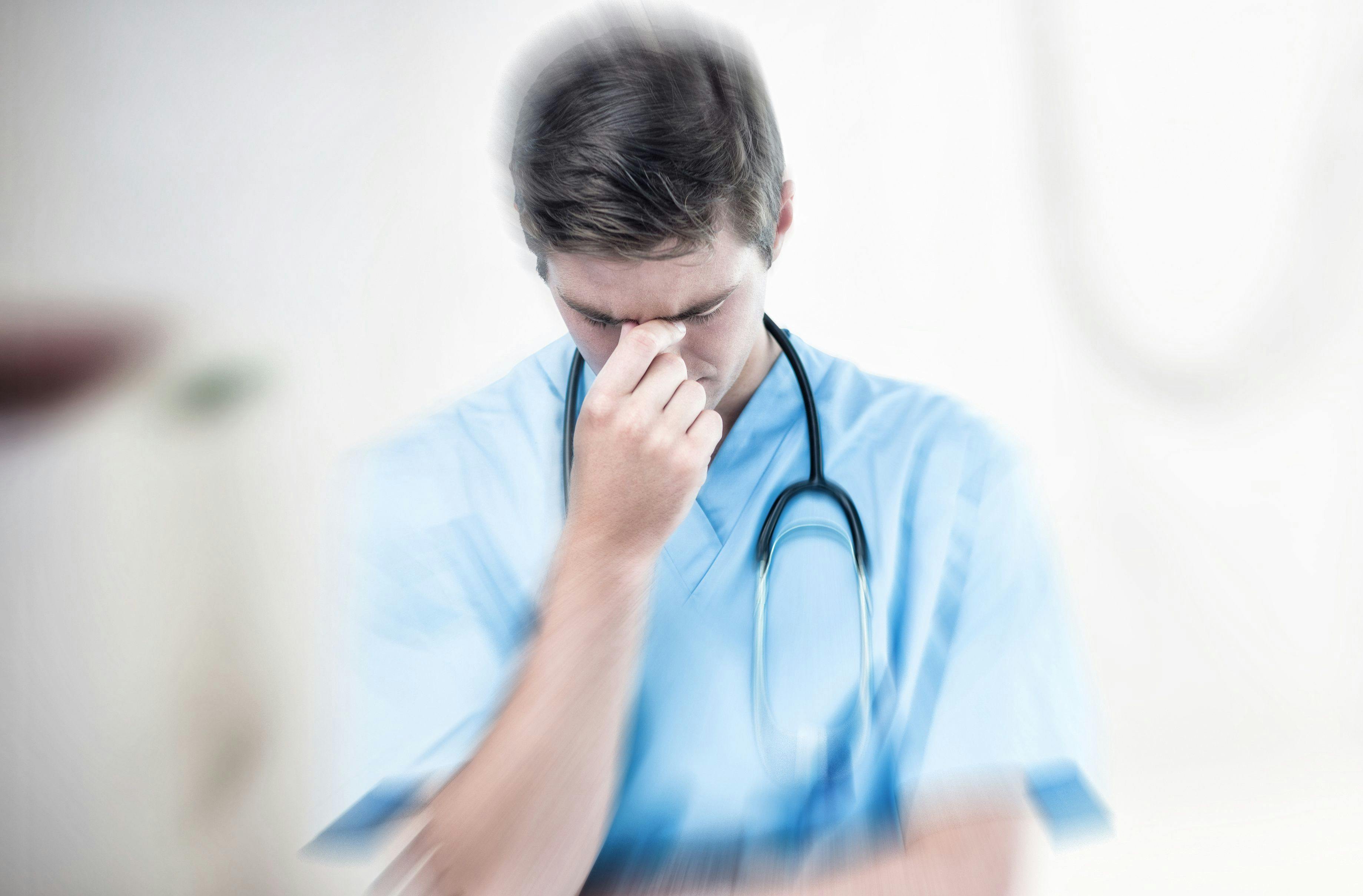 Male doctor suffering | Image Credit: vectorfusionart - stock.adobe.com
