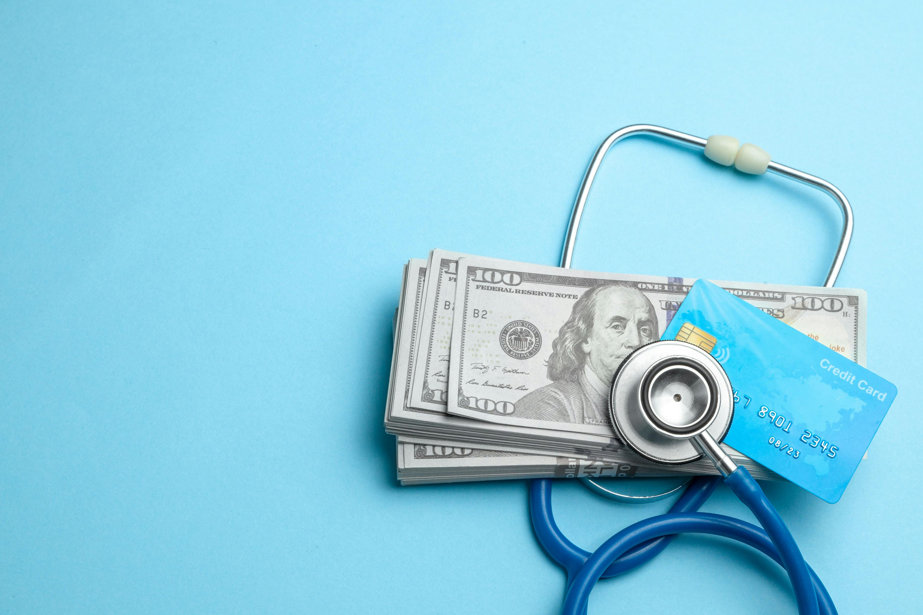 Stethoscope with cash and credit | Image Credit: © adragan - stock.adobe.com