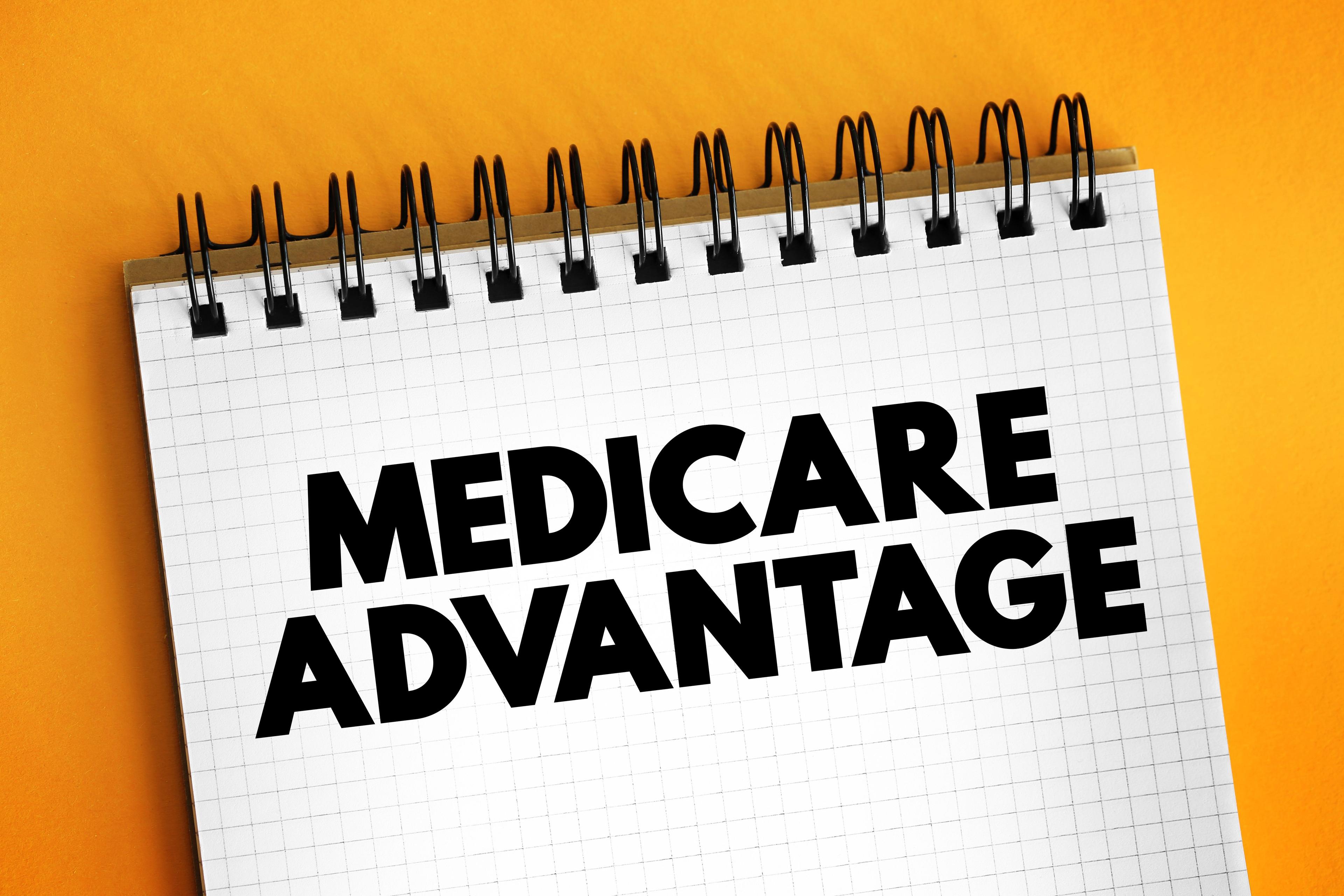 "Medicare Advantage" written in an open notebook | Image Credit: dizain - stock.adobe.com