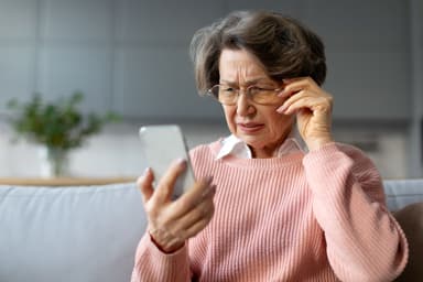 Woman squinting at phone | Image credit: Home-stock - stock.adobe.com