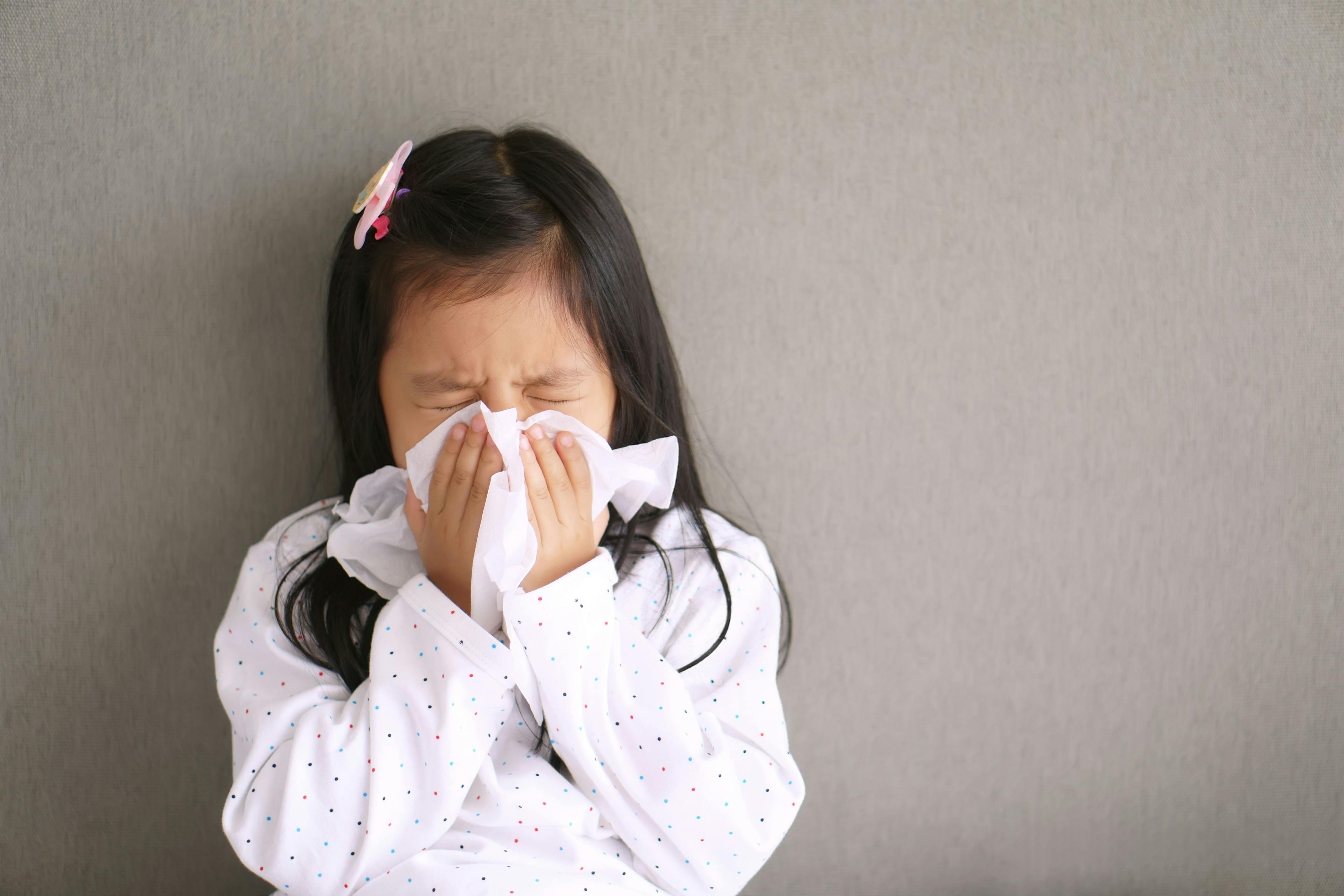 Young child sneezing | Image credit: kornnphoto - stock.adobe.com