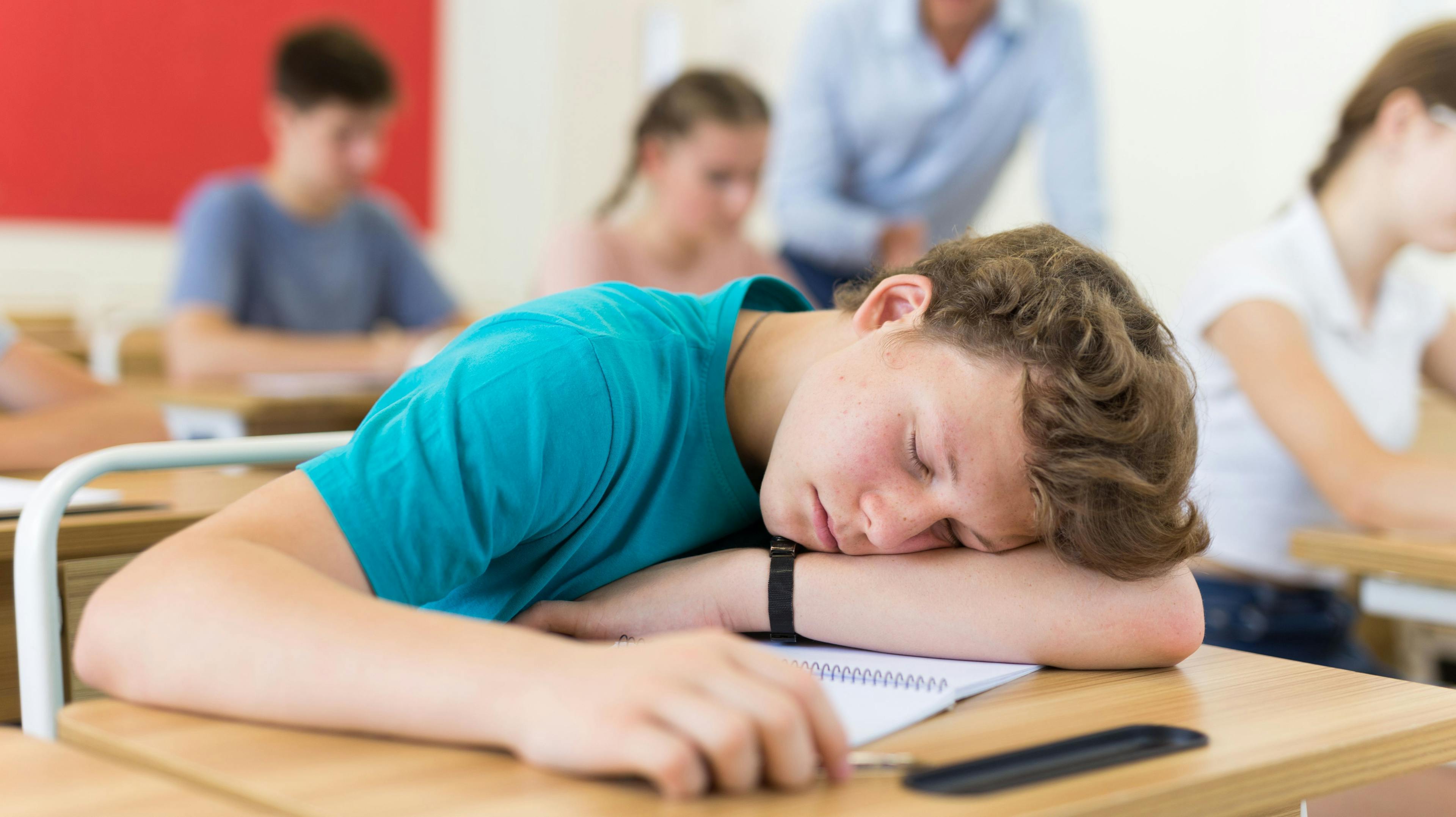 Teenager asleep at desk | Image credit: JackF - stock.adobe.com