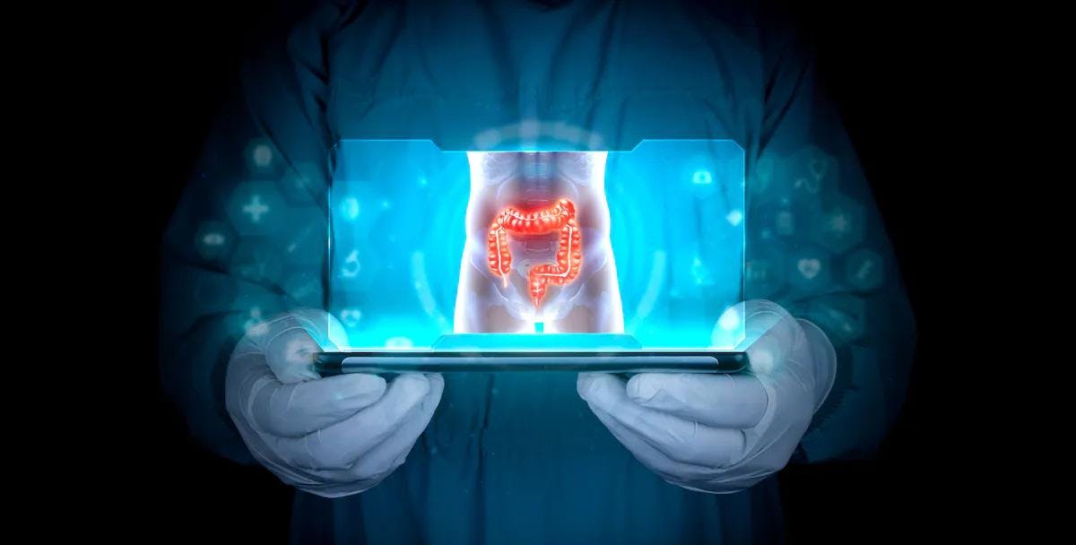 Doctor projects the human large intestine on the tablet | Image credit: Tom - stock.adobe.com