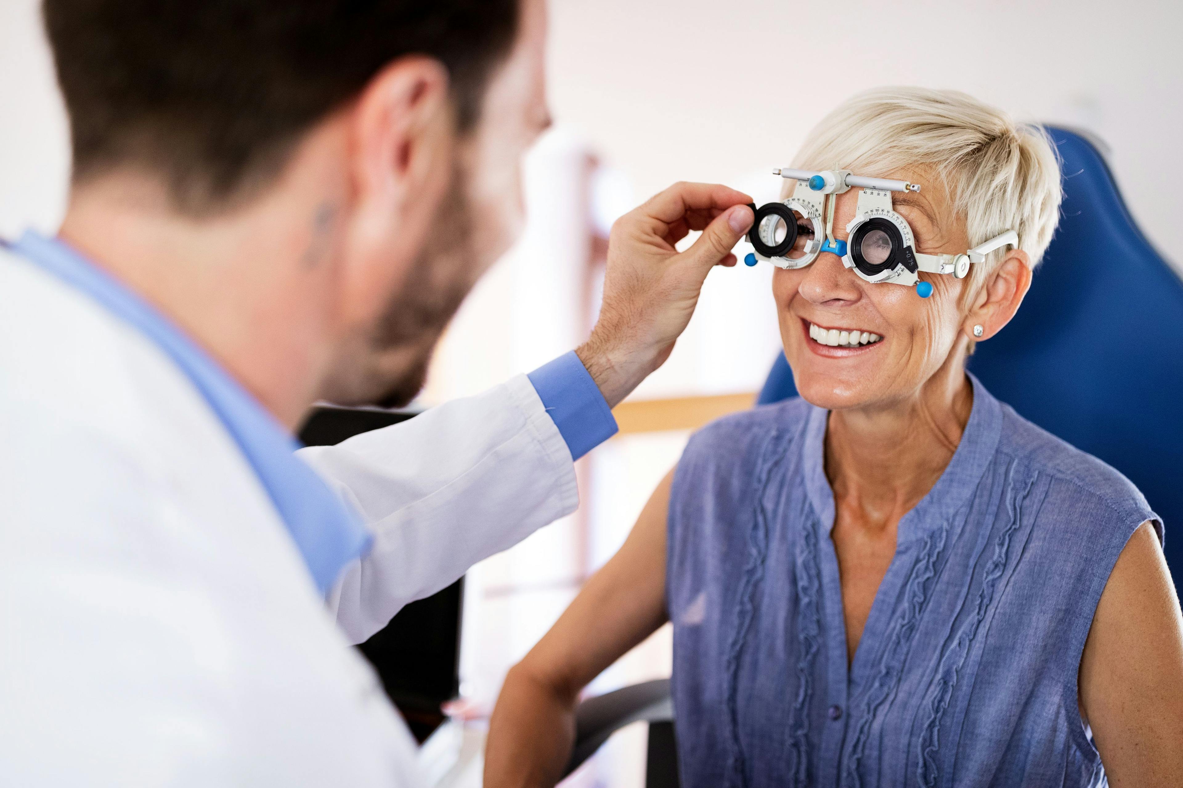 Older woman taking eye exam | Image credit: NDABCREATIVITY – stock.adobe.com