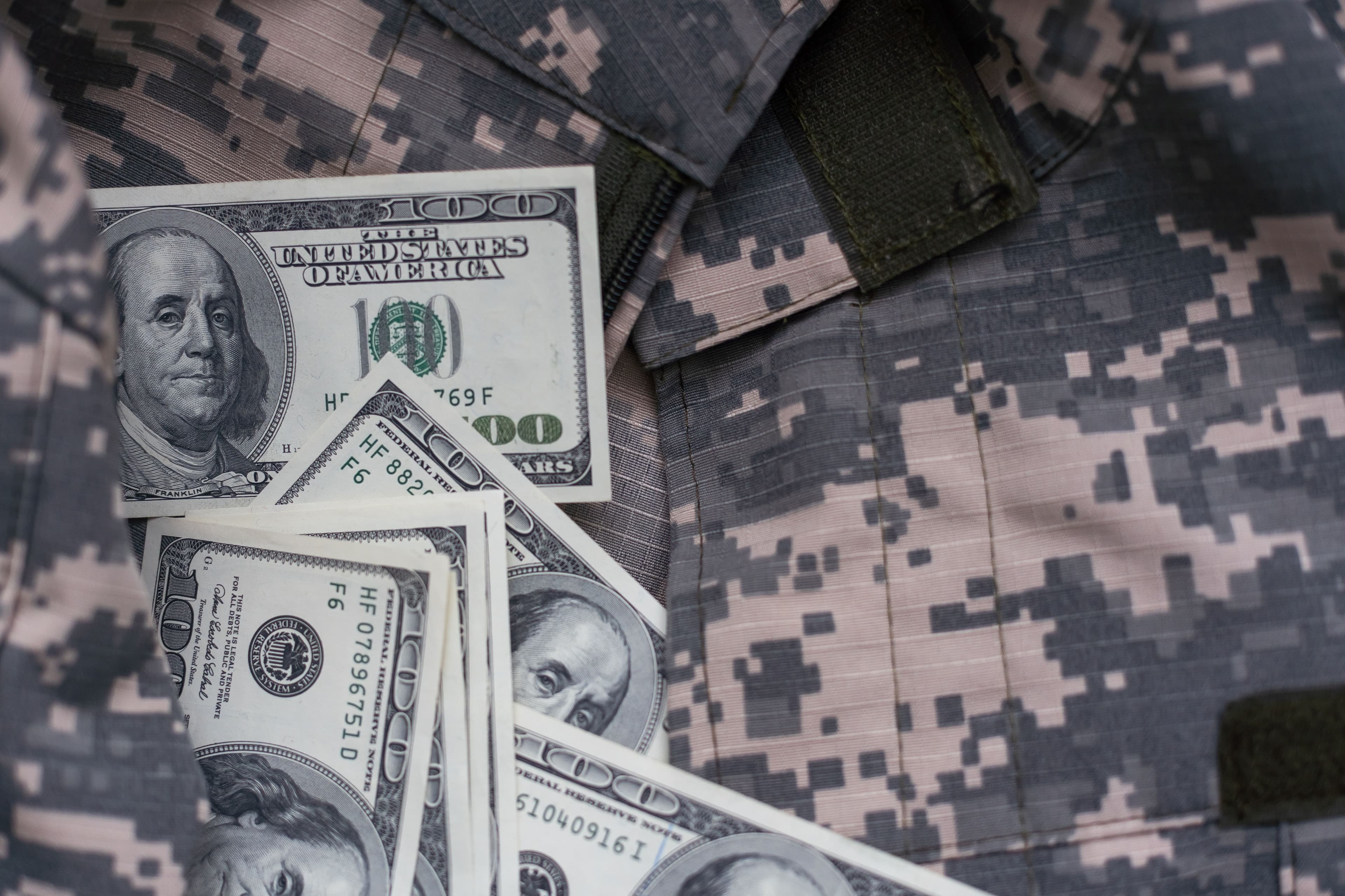 soldier camouflage, military uniform, money | Image credit: Angelov – stock.adobe.com