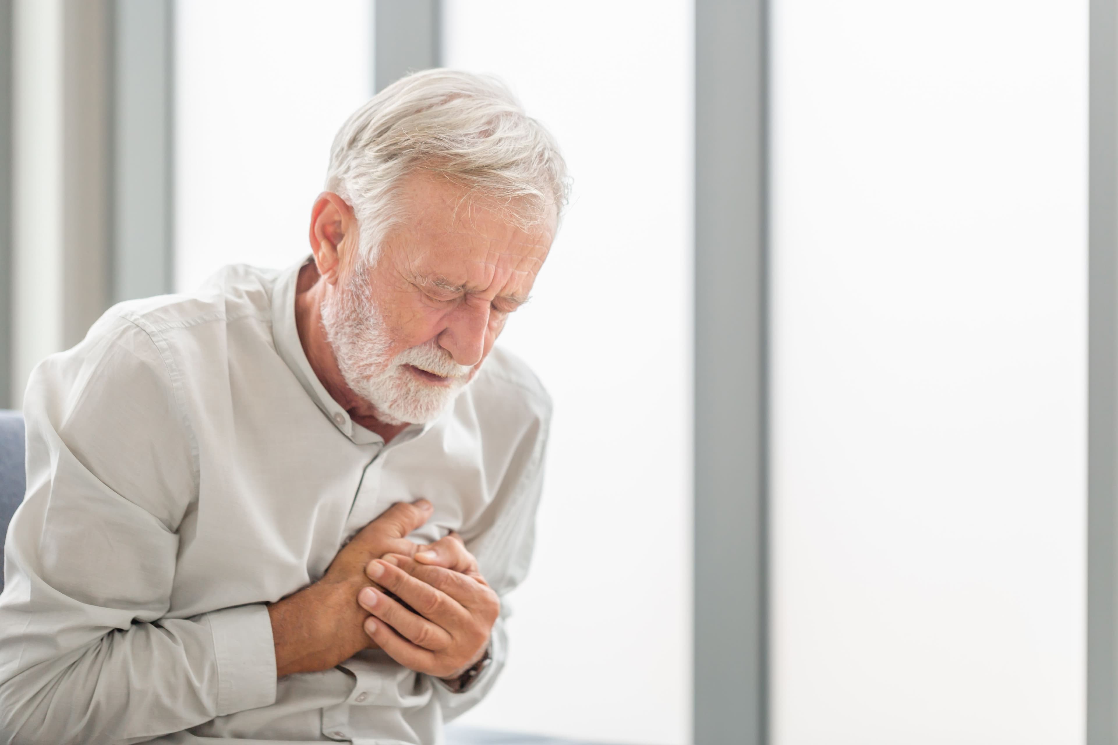 Man having heart attack | Image credit: JU.STOCKER – stock.adobe.com