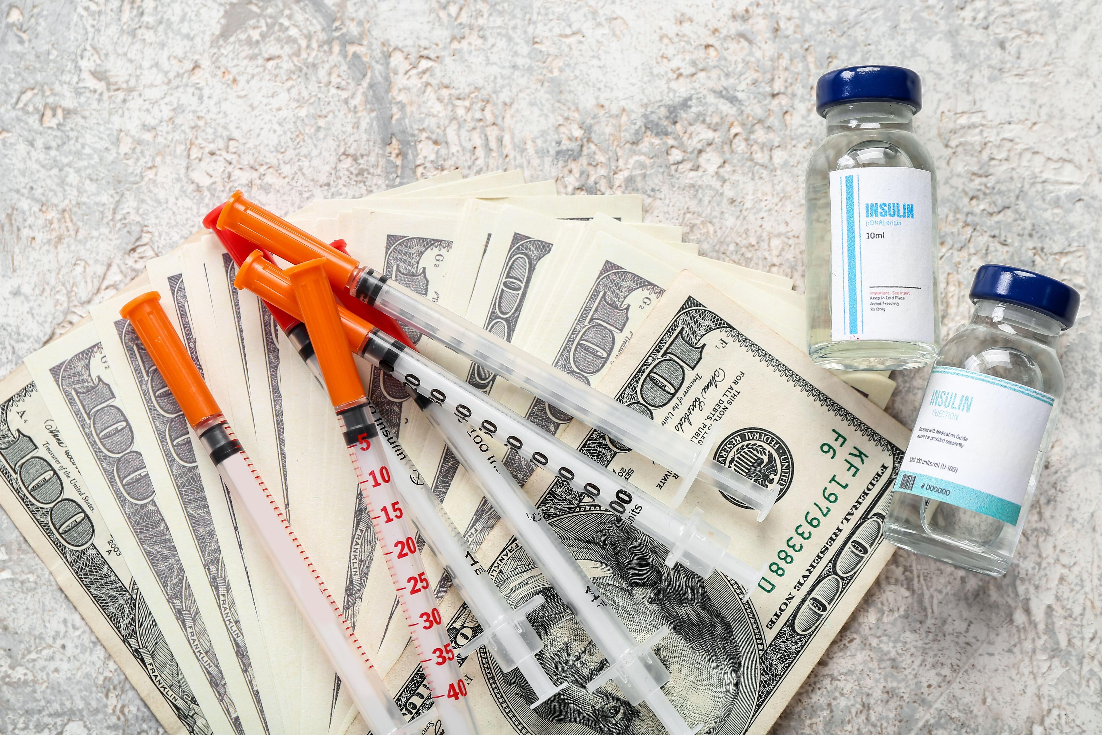 Insulin and money | Image credit: Pixel-Shot - stock.adobe.com