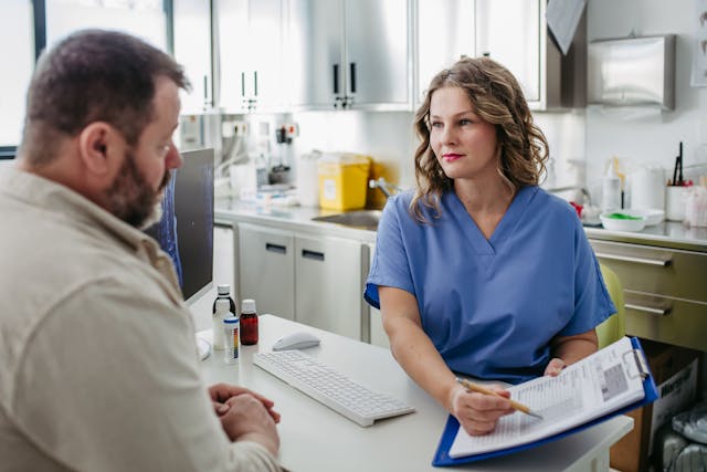 Doctor and patient discussing treatment plan | Image credit: Halfpoint – stock.adobe.com