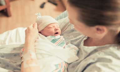 Mother holding newborn baby | Image credit: kieferpix -stock.adobe.com