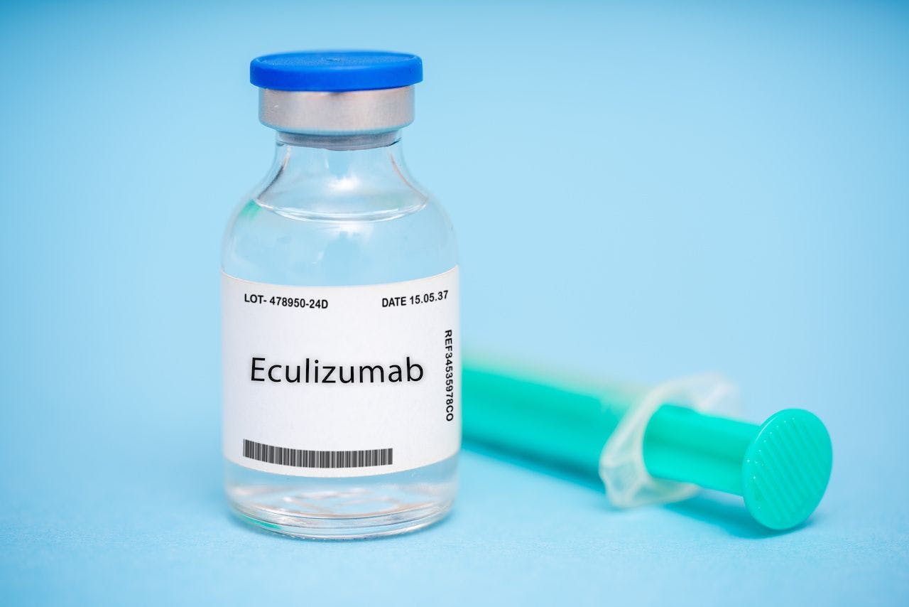 Vial with eculizumab label with a needle | Image credit: luchschenF - stock.adobe.com