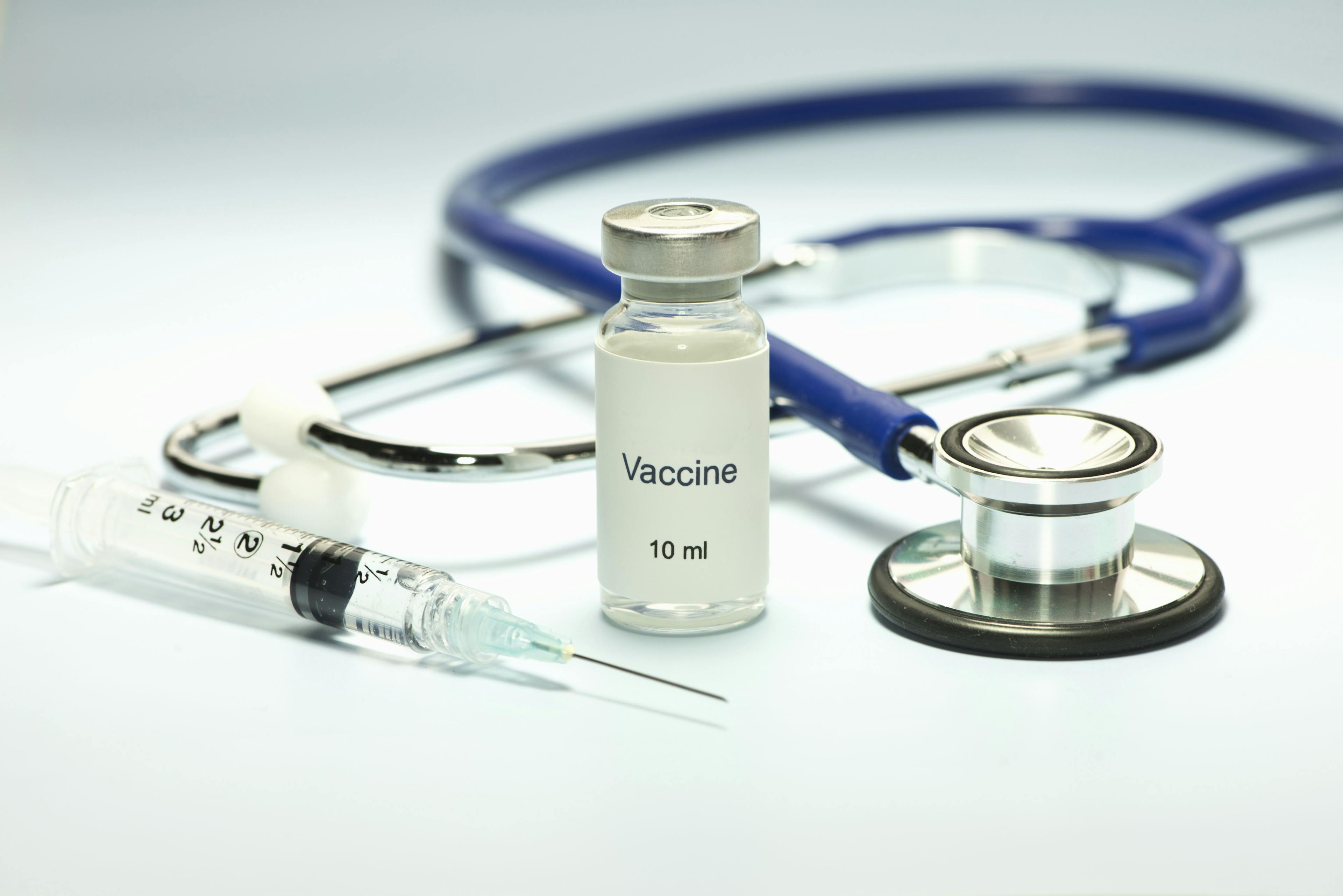 vaccine vial, syringe, and stethoscope