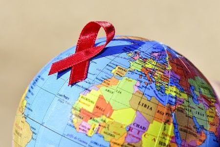 HIV red ribbon on globe