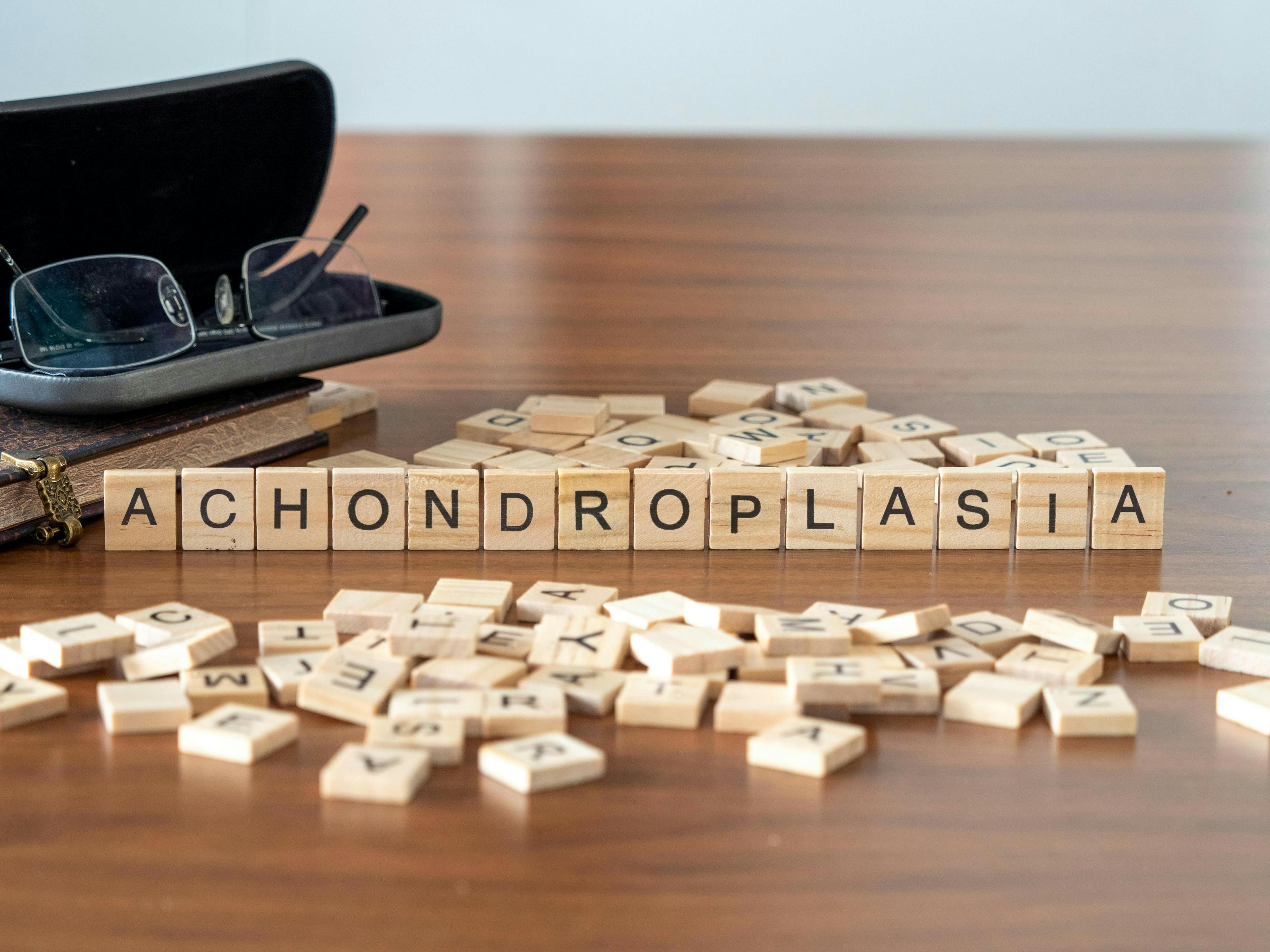 achondroplasia word or concept represented by wooden letter tiles on a wooden table with glasses and a book | lexiconimages - stock.adobe.com 