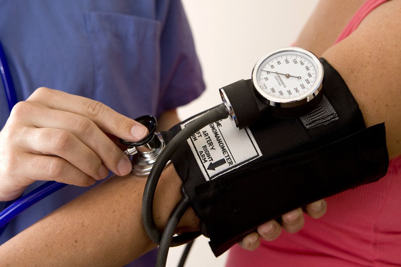 Measuring blood pressure.