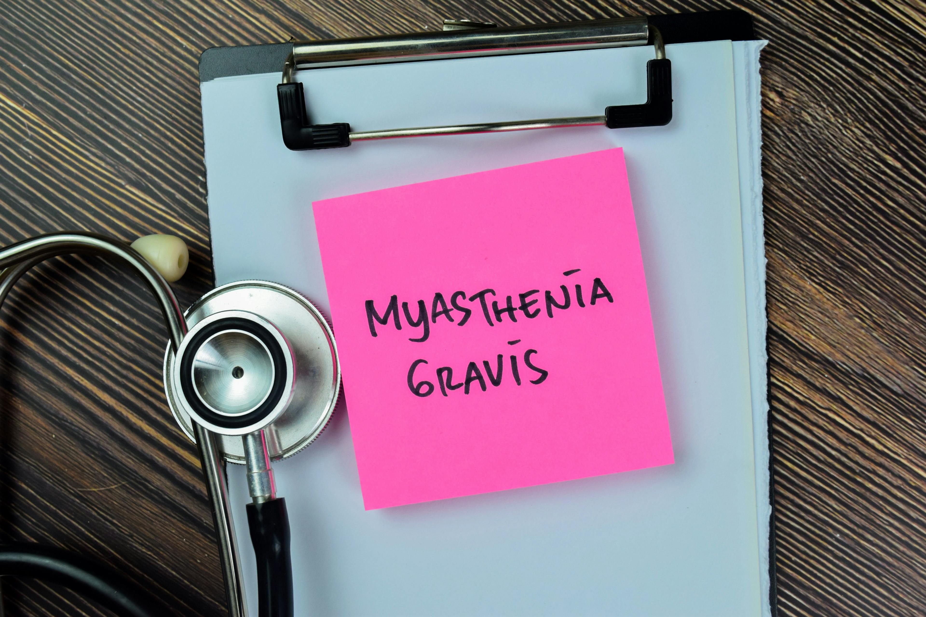 Concept of myasthenia gravis write on sticky notes with stethoscope isolated on Wooden Table | Image Credit: syahrir - stock.adobe.com