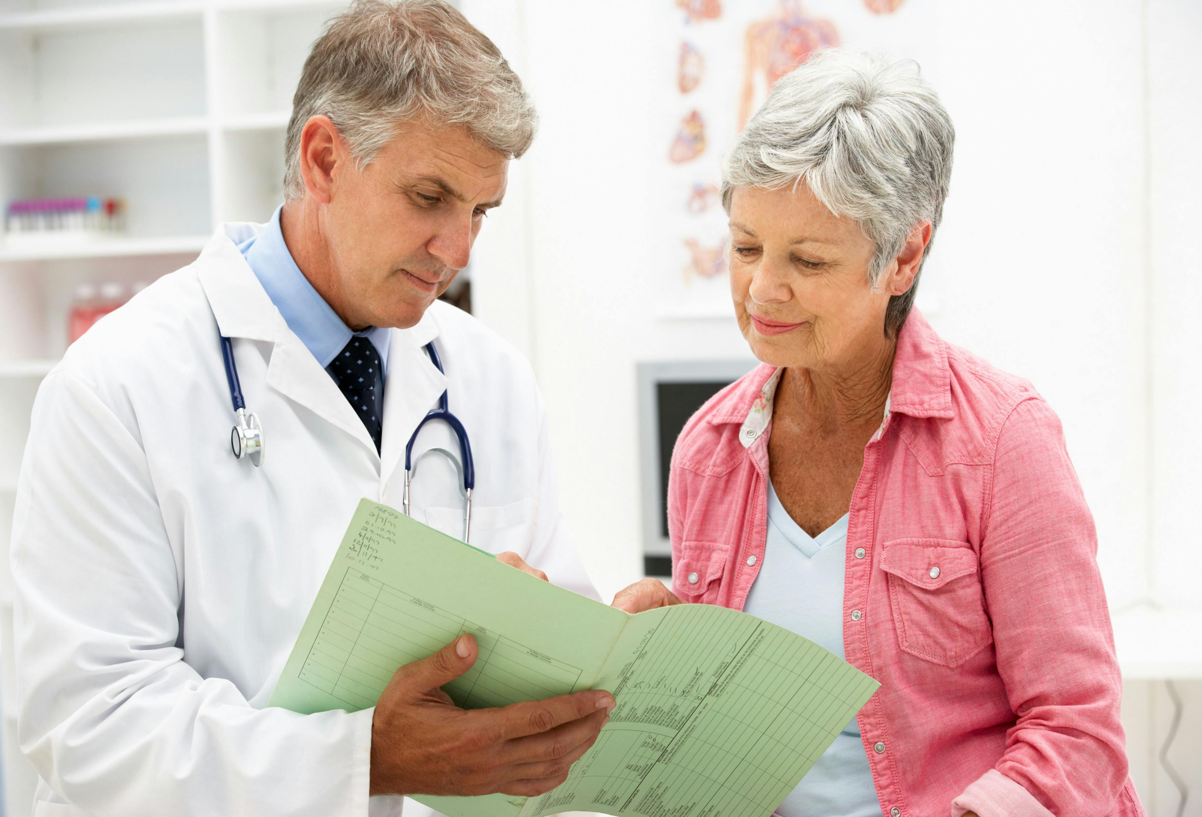 Patient and doctor discussing record
