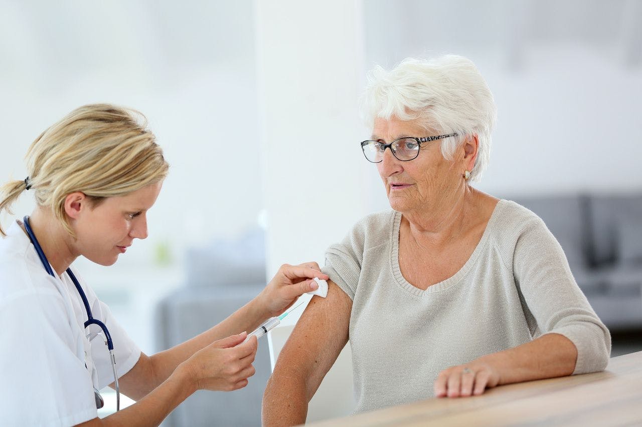 Older adult getting a vaccine