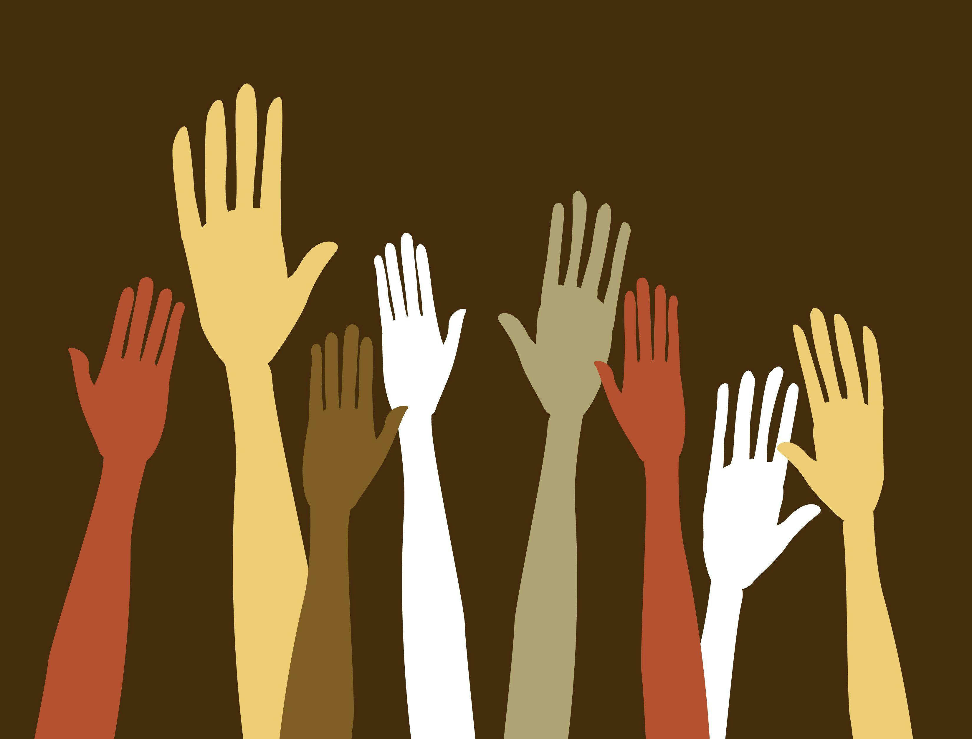 Raised hands of diverse populations.