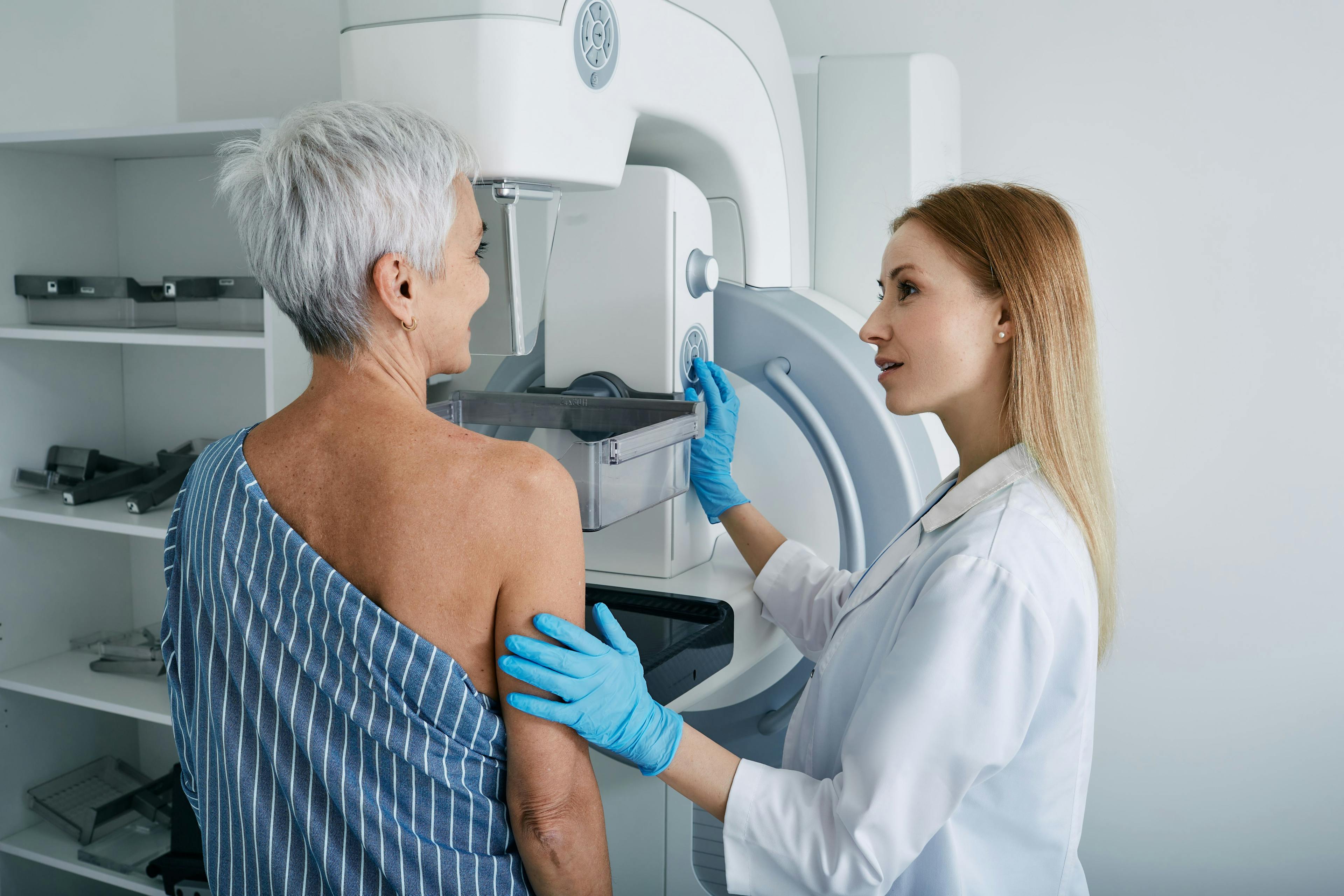 Older adult patient receiving mammogram | Image Credit: Peakstock - stock.adobe.com